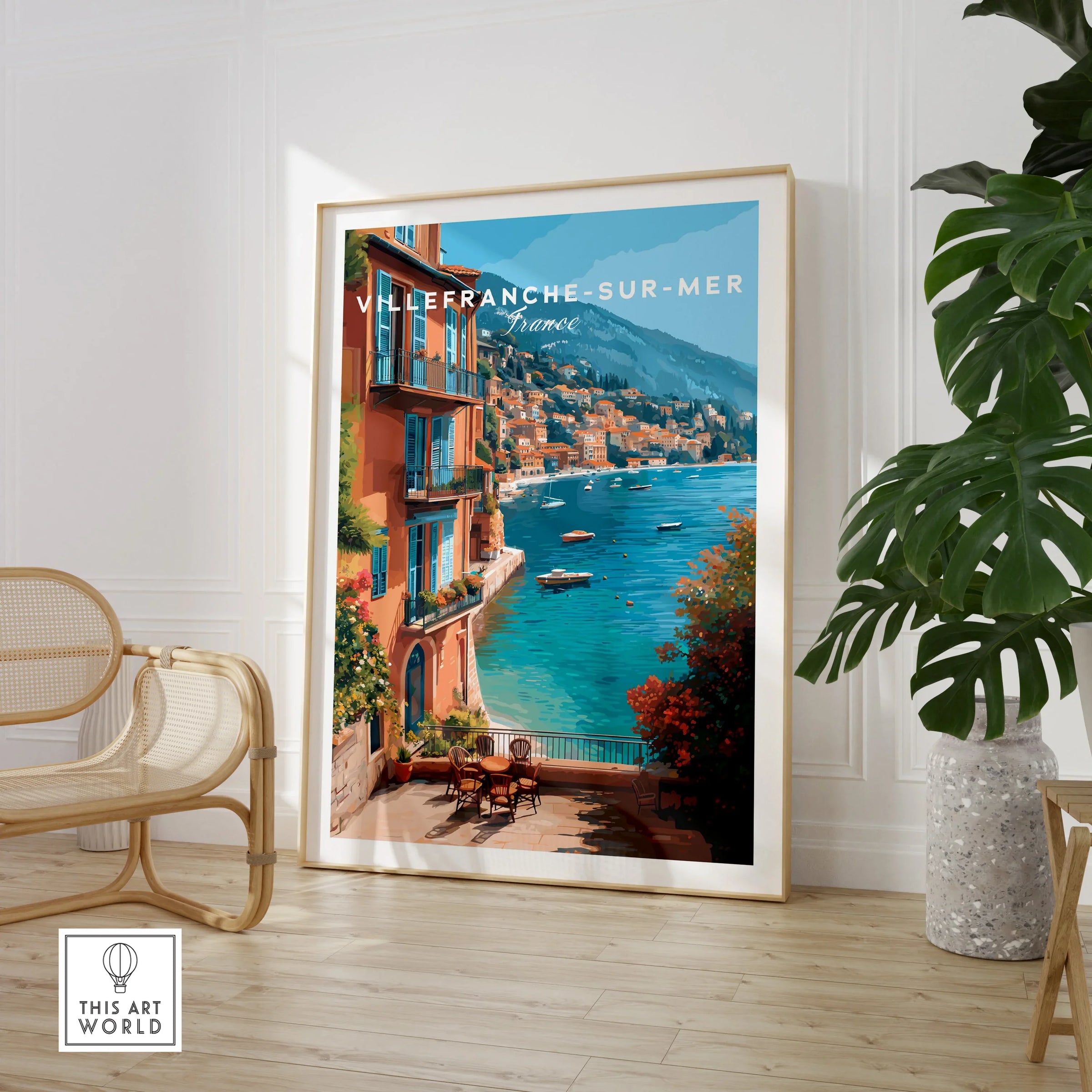 Villefranche-sur-Mer travel poster framed print in modern room with chair and plant