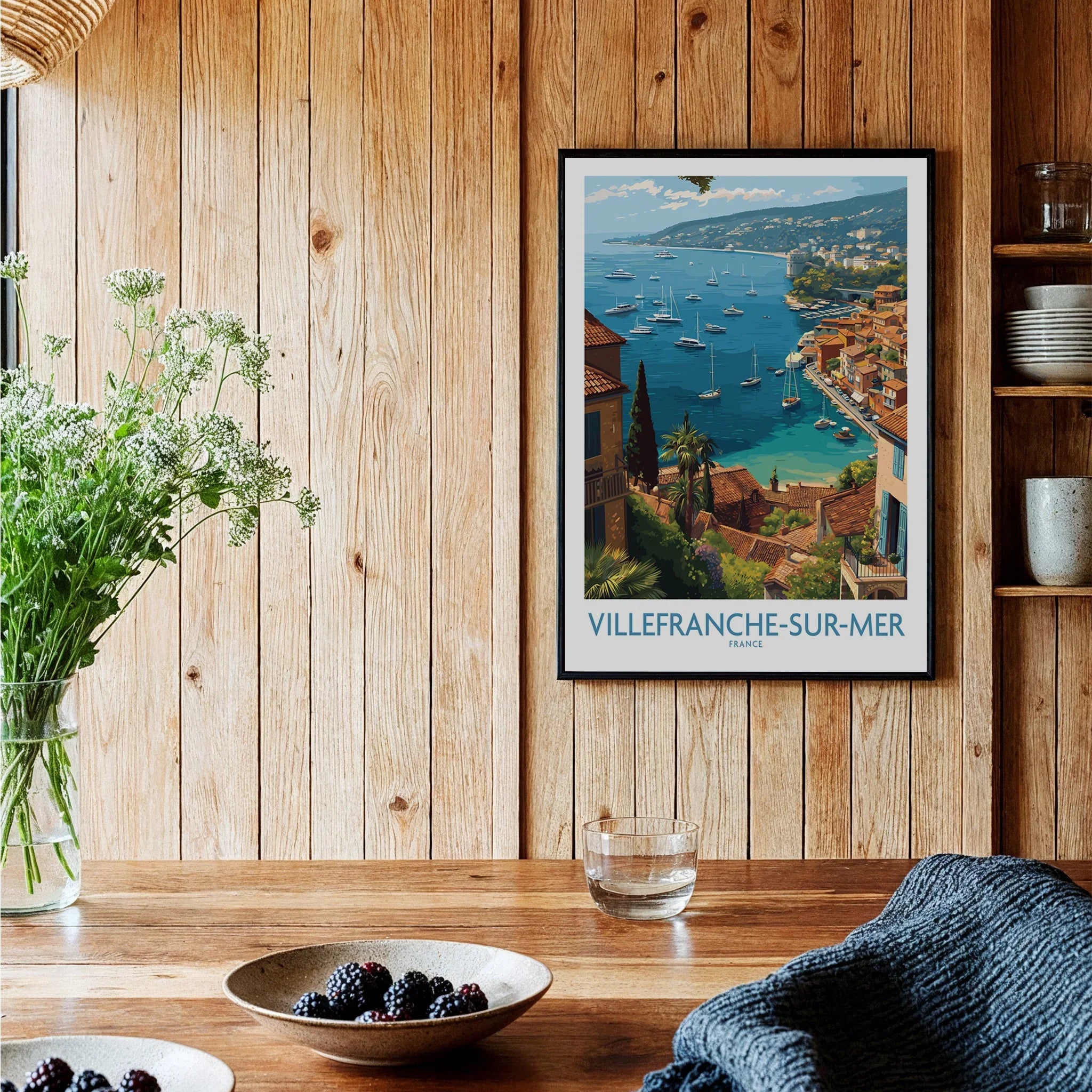 Villefranche-sur-Mer travel poster art print in black frame, displayed in cozy kitchen setting