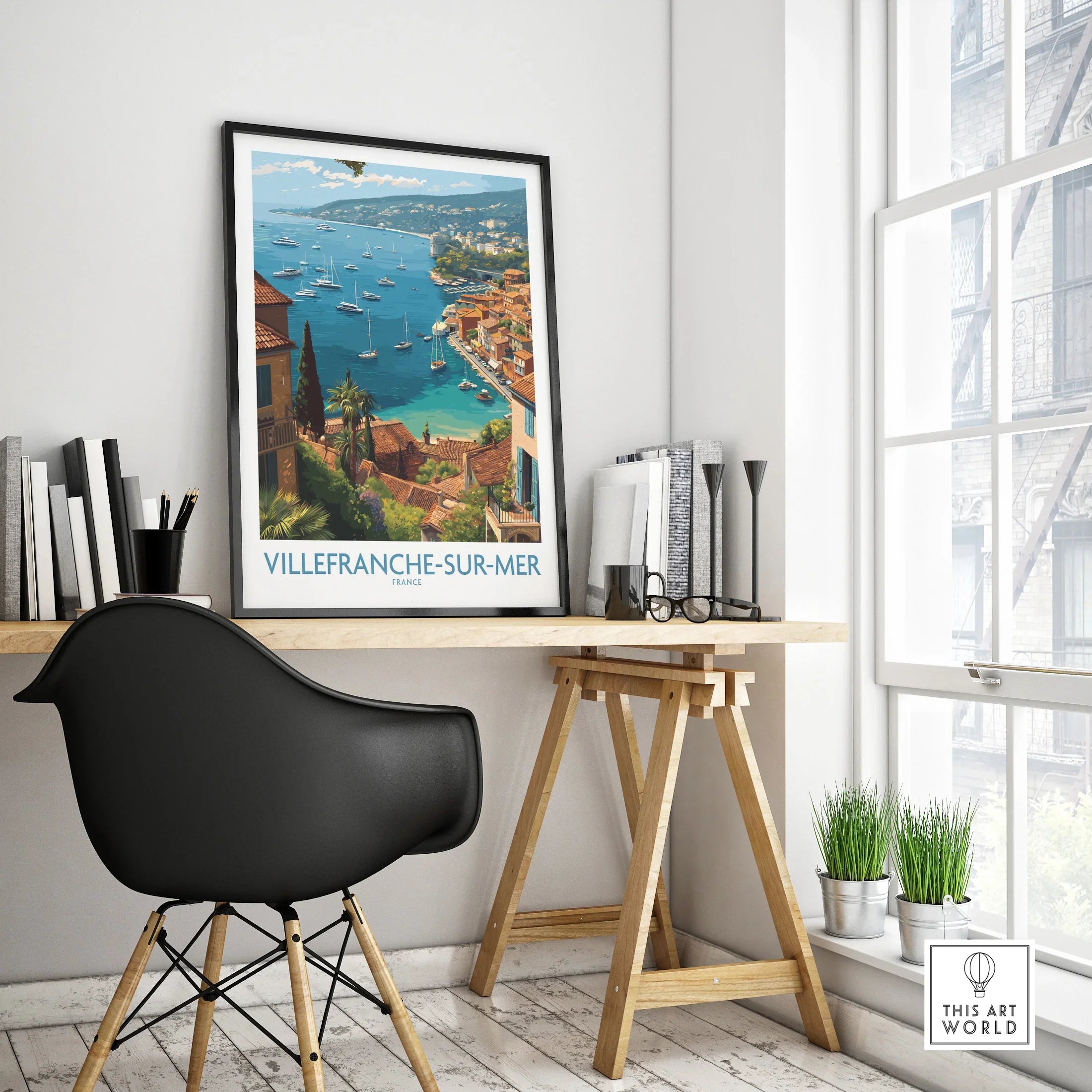 Villefranche-sur-Mer travel poster in black frame on modern office desk, coastal wall art decor