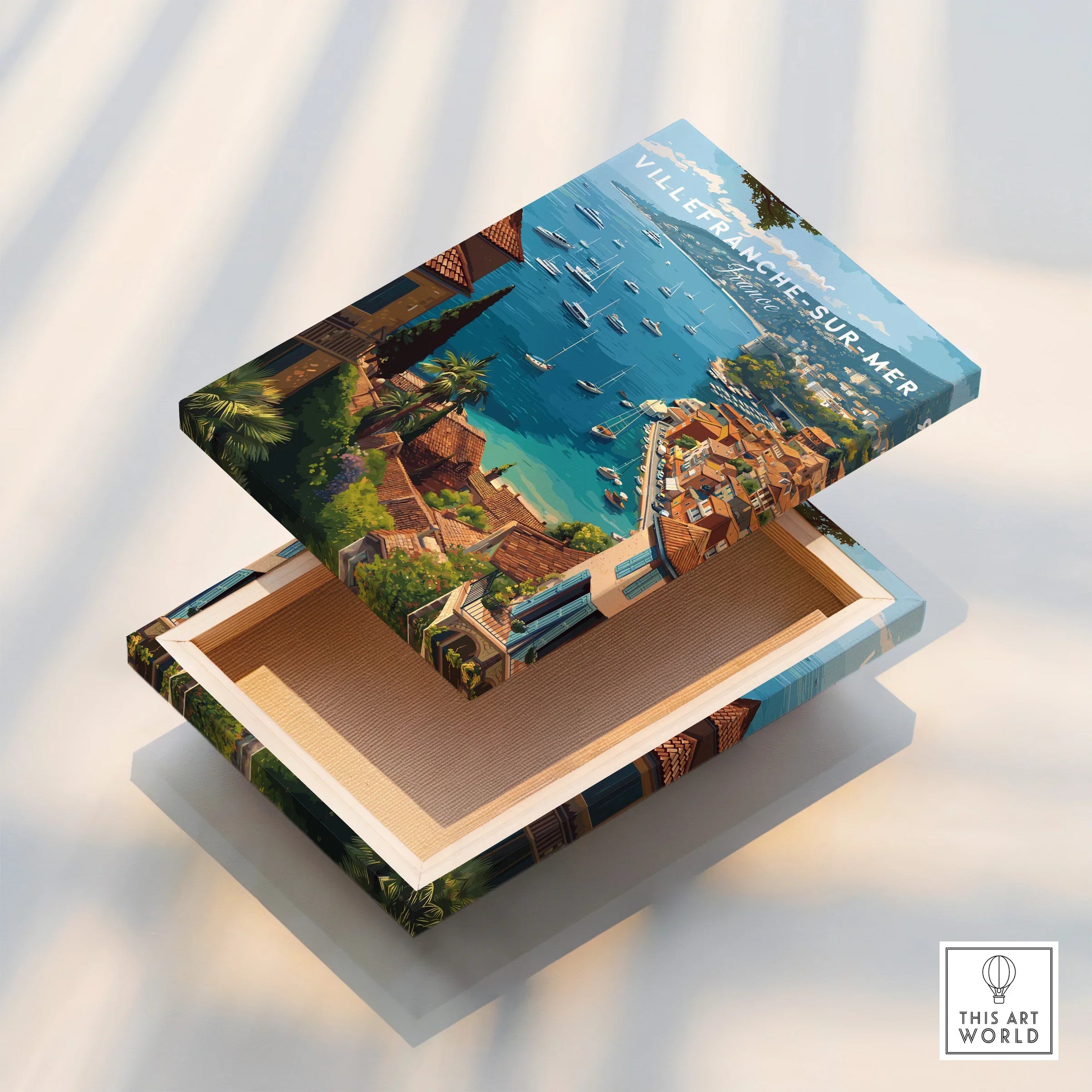 Villefranche-sur-Mer canvas print with detailed coastal town and harbor artwork on a wooden box lid.