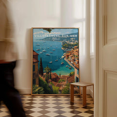 Framed Villefranche-sur-Mer travel poster with vibrant coastal scene on checkered floor