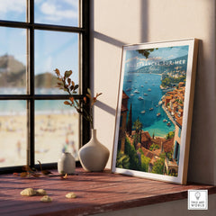 Framed Villefranche-sur-Mer travel poster on windowsill with bay view, home decor art