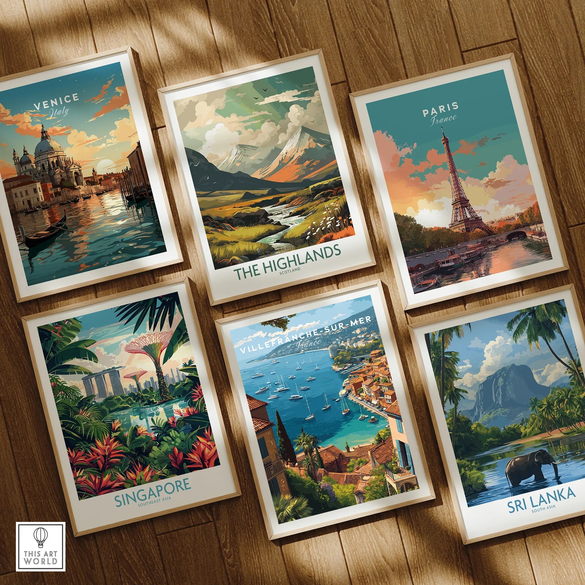 Set of six framed travel posters with city and nature scenes on a wooden floor