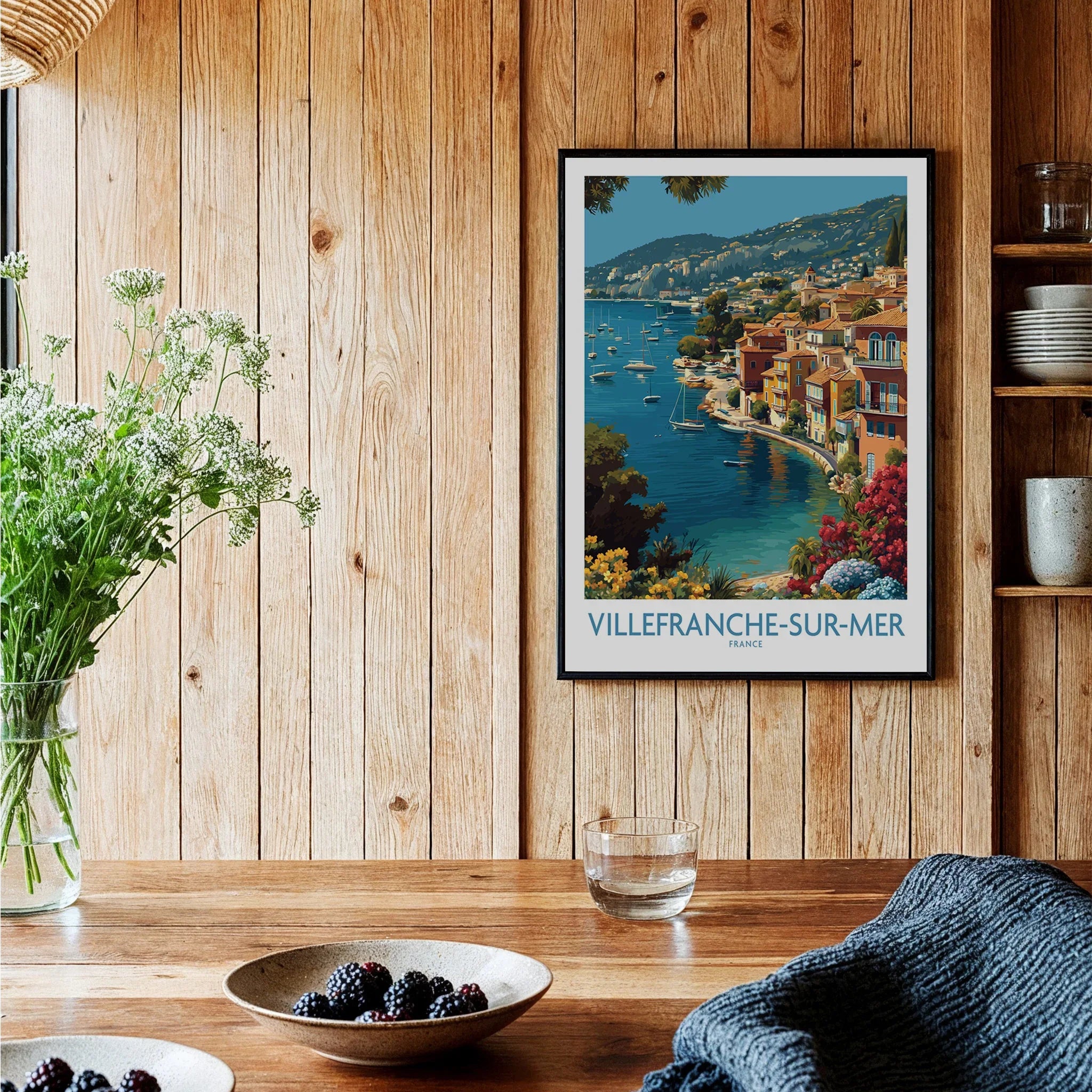 Villefranche-sur-Mer travel poster art print in black frame on wood kitchen wall