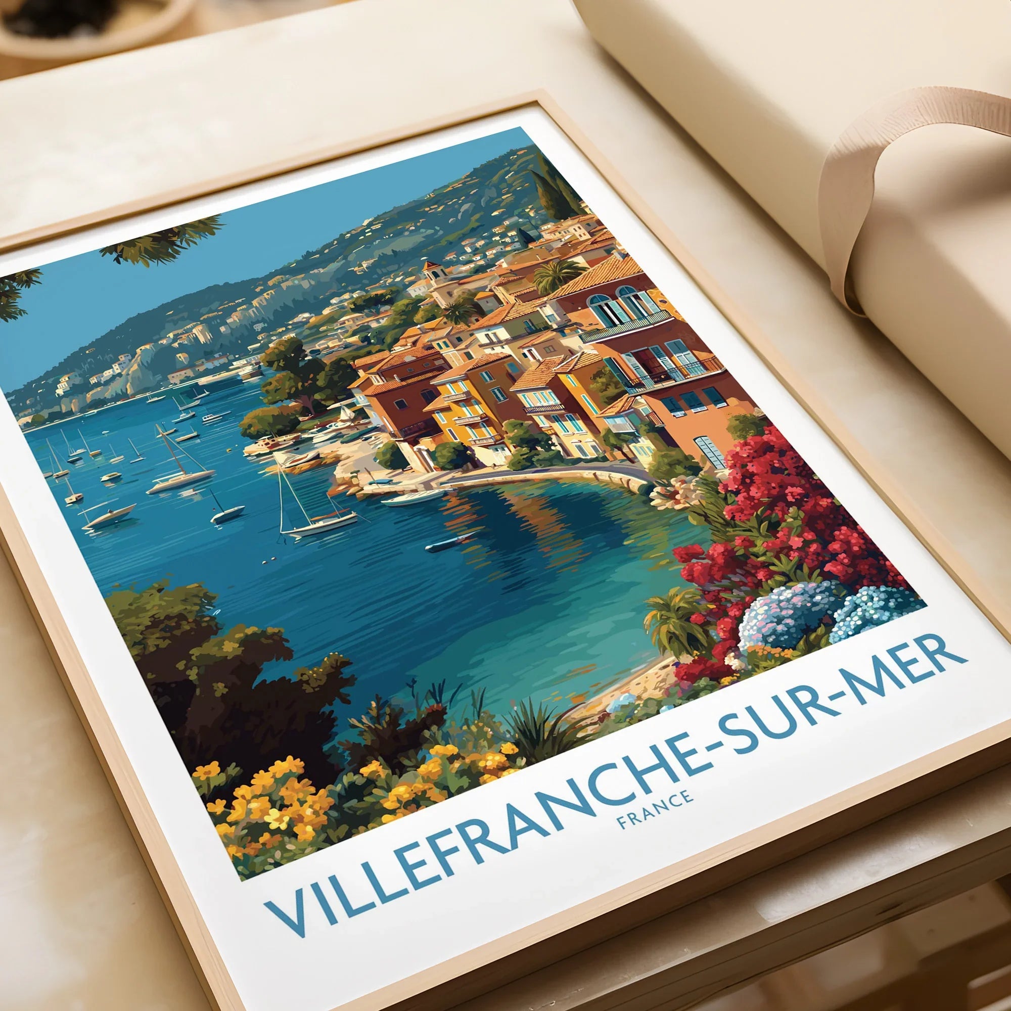 Framed Villefranche-sur-Mer travel poster print with colorful coastal town and blue sea.