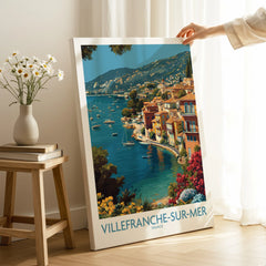 Villefranche-sur-Mer travel poster canvas print with colorful coastal artwork, hand holding in bright room