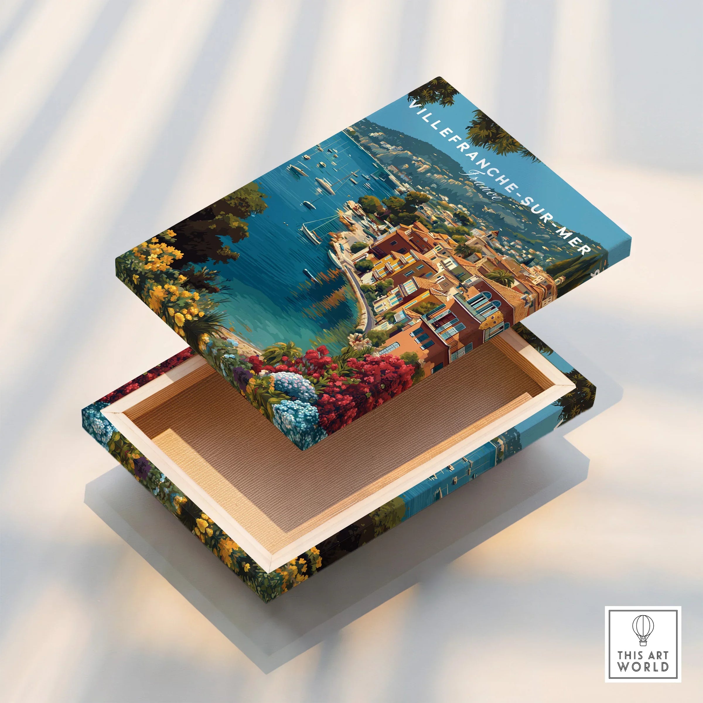 Villefranche-sur-Mer canvas print with vibrant coastal town, flowers, sea, and floating frame.