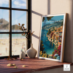 Villefranche-sur-Mer framed travel print in natural wood frame on windowsill with coastal scene
