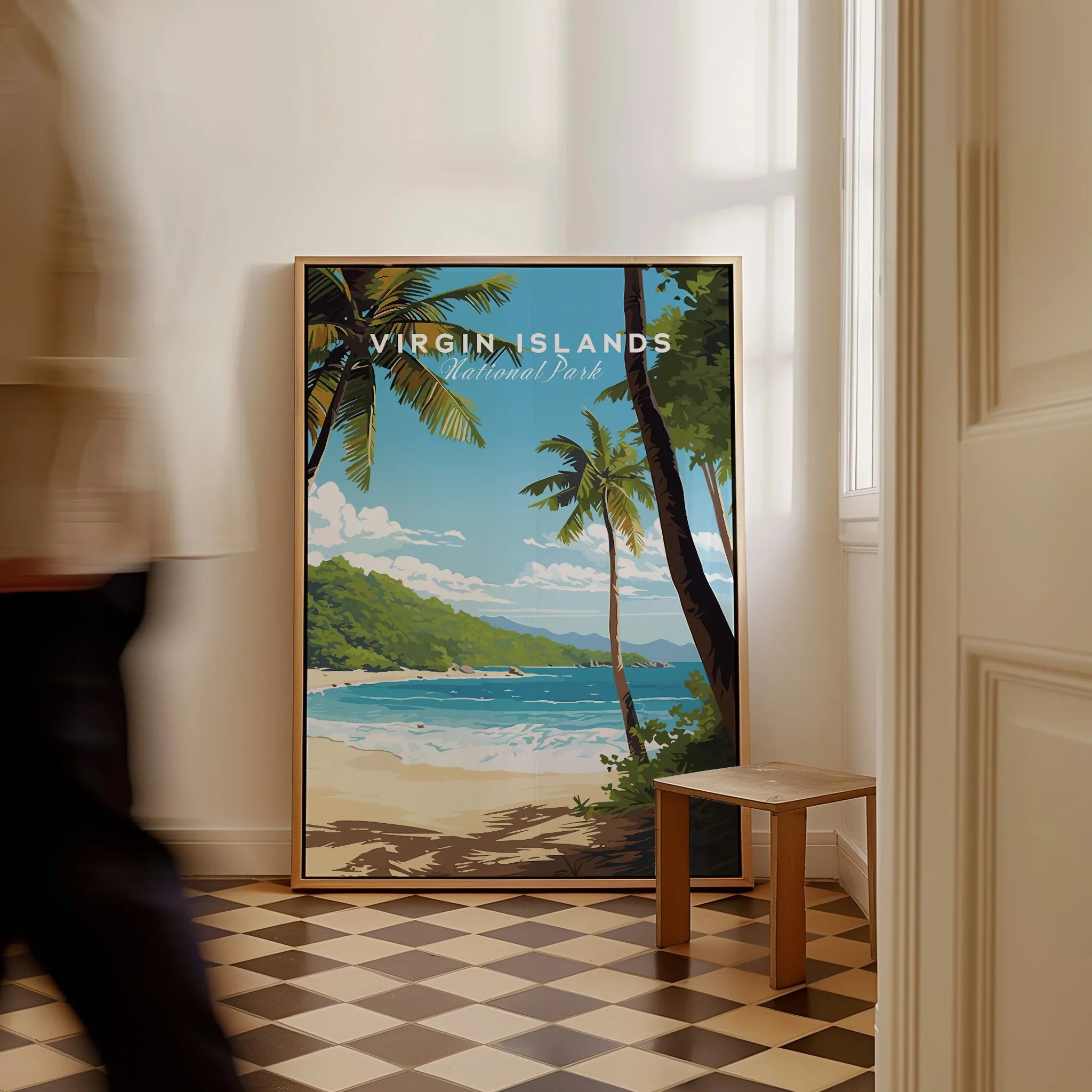 Framed Virgin Islands National Park travel poster with beach scene, leaning on floor indoors.