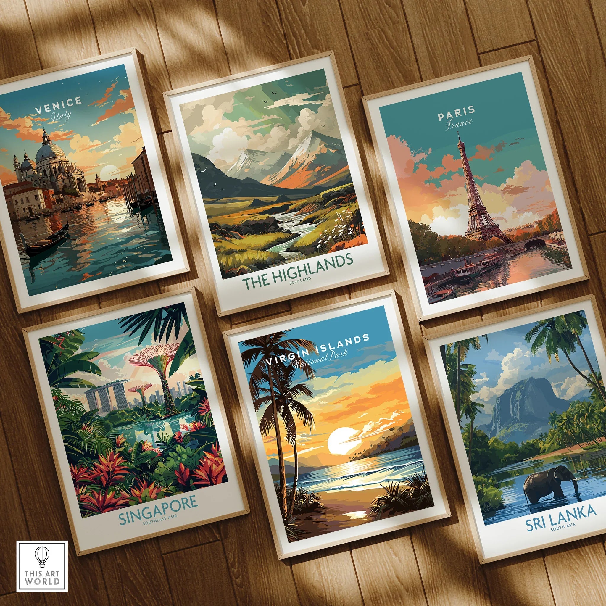 Set of six framed travel posters featuring Venice, Paris, Singapore, Virgin Islands, Highlands, and Sri Lanka on a wooden floor.