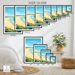 Various sizes of the Daymer Bay Cornwall Print displayed in a stylish living space with a plant.