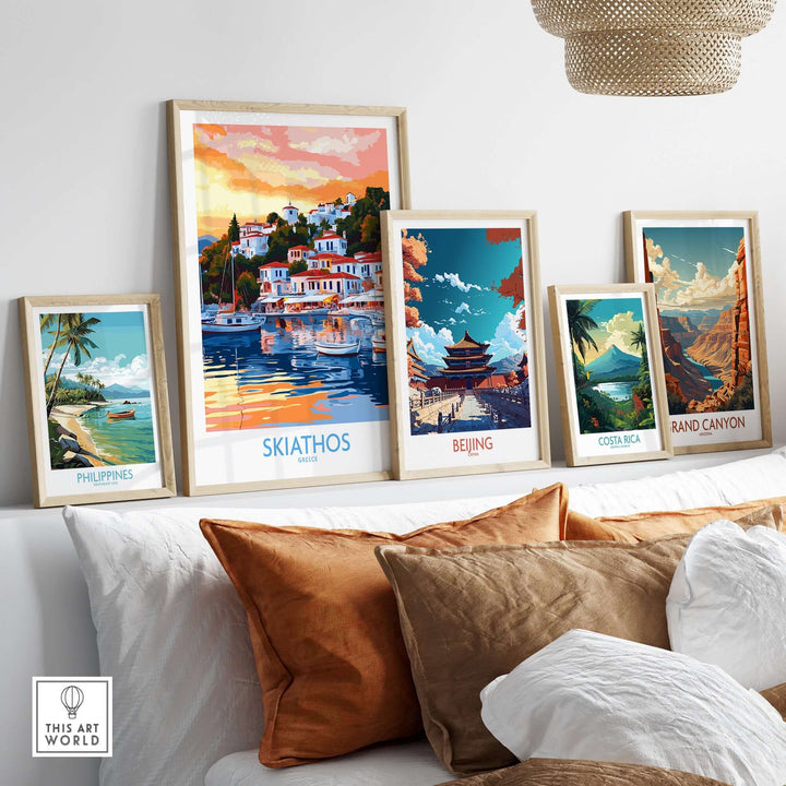 Wall art prints featuring Skiathos Greece, Philippines, Beijing, Costa Rica, and the Grand Canyon on a cozy couch.