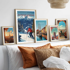 Colorful gallery wall featuring Whiteface Mountain ski print and various travel posters in stylish frames.