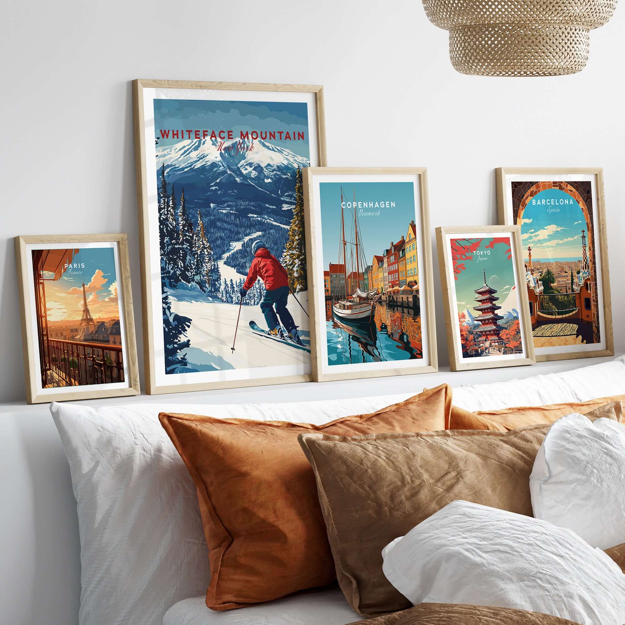 Colorful gallery wall featuring Whiteface Mountain ski print and various travel posters in stylish frames.