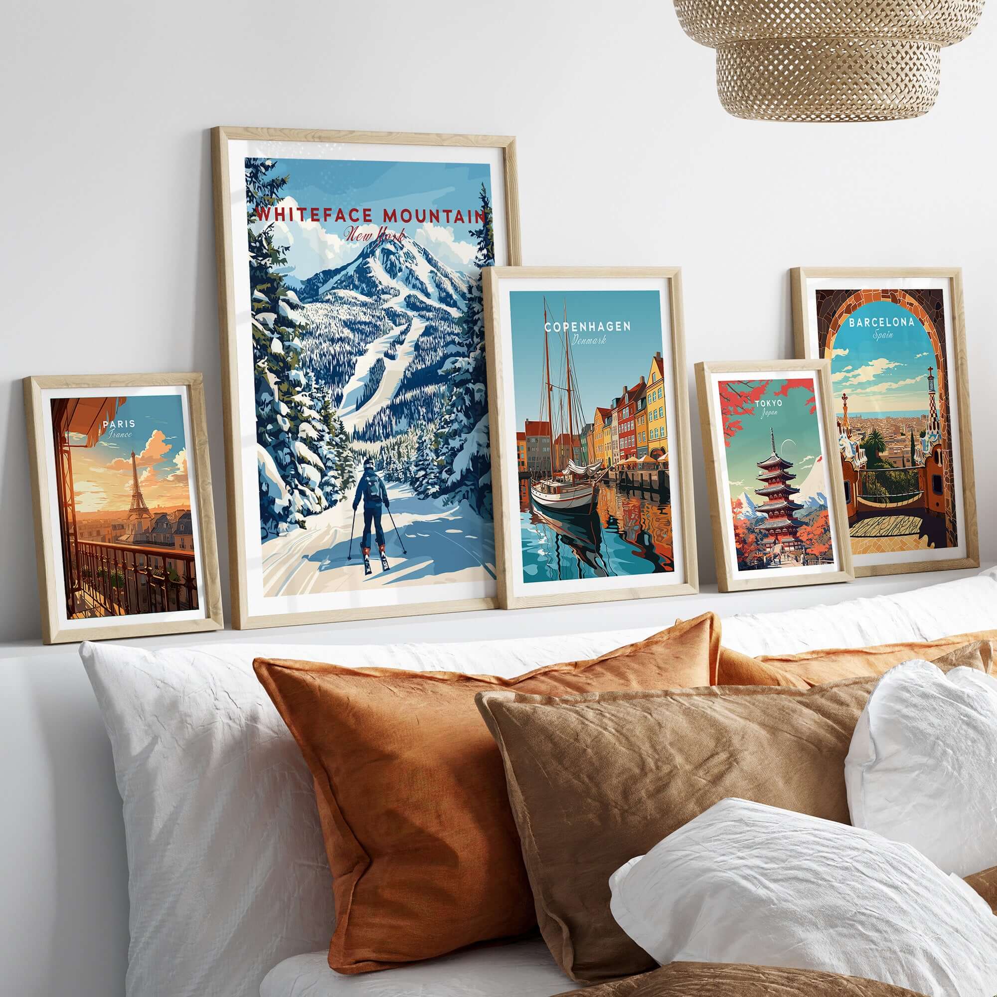 Gallery of travel posters including Whiteface Mountain ski art, enhancing a cozy living room decor.