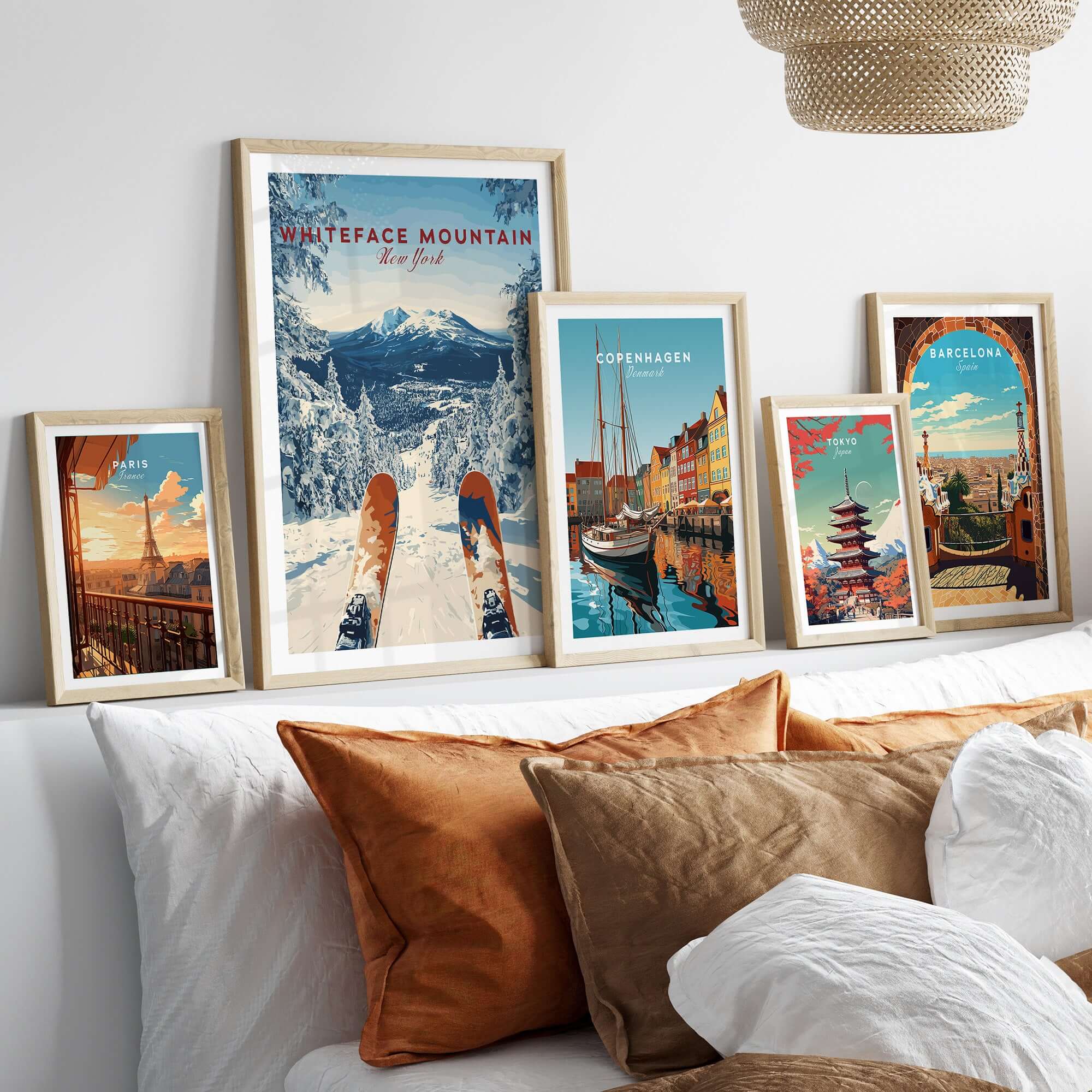 Framed Whiteface Mountain snow scene print with travel posters on a cozy living room wall.