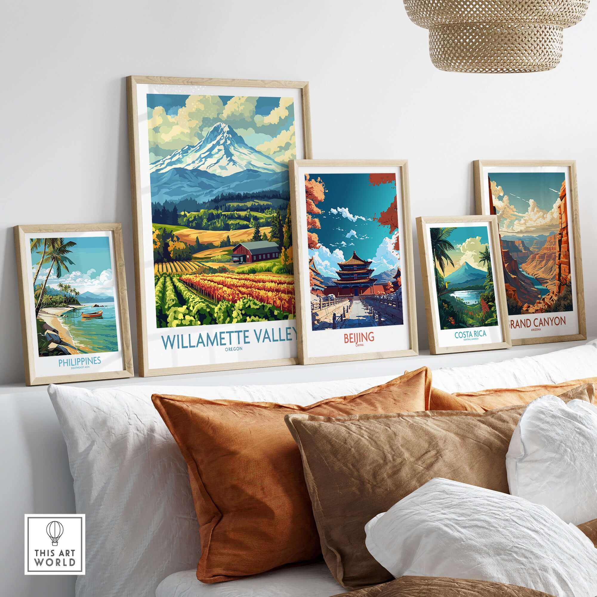 Willamette Valley Oregon Poster among other travel-themed posters on a stylish shelf with decorative pillows.