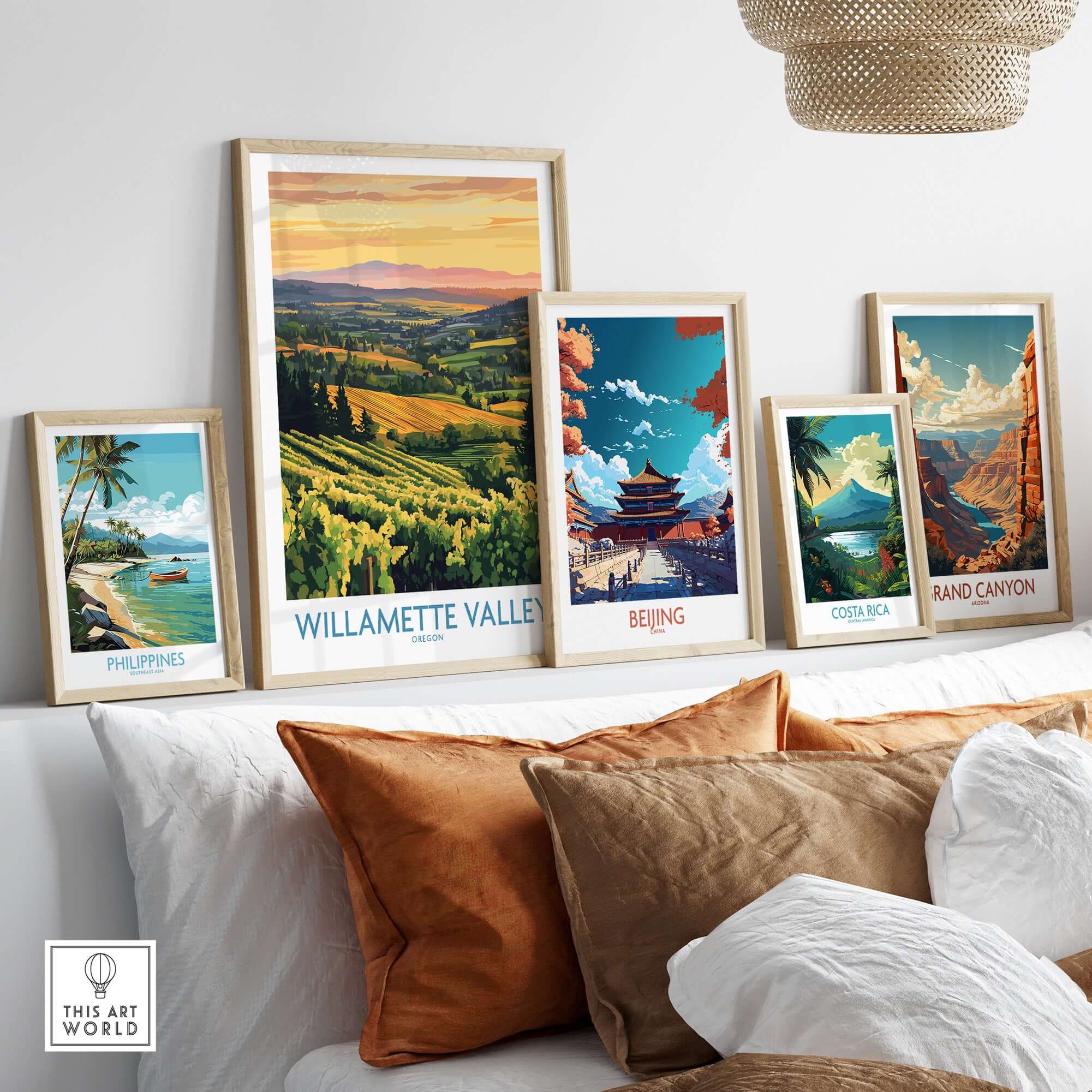 Willamette Valley Poster among framed travel posters on a stylish shelf with decorative pillows.