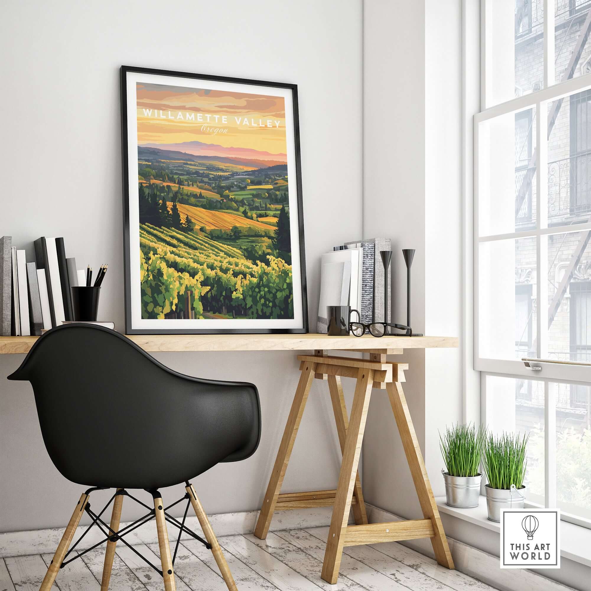 Willamette Valley Print displayed in a stylish workspace, showcasing vineyard landscape and warm sunset colors.