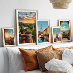 Willamette Valley Wall Art displayed among other vibrant travel-themed artworks on a stylish bed.