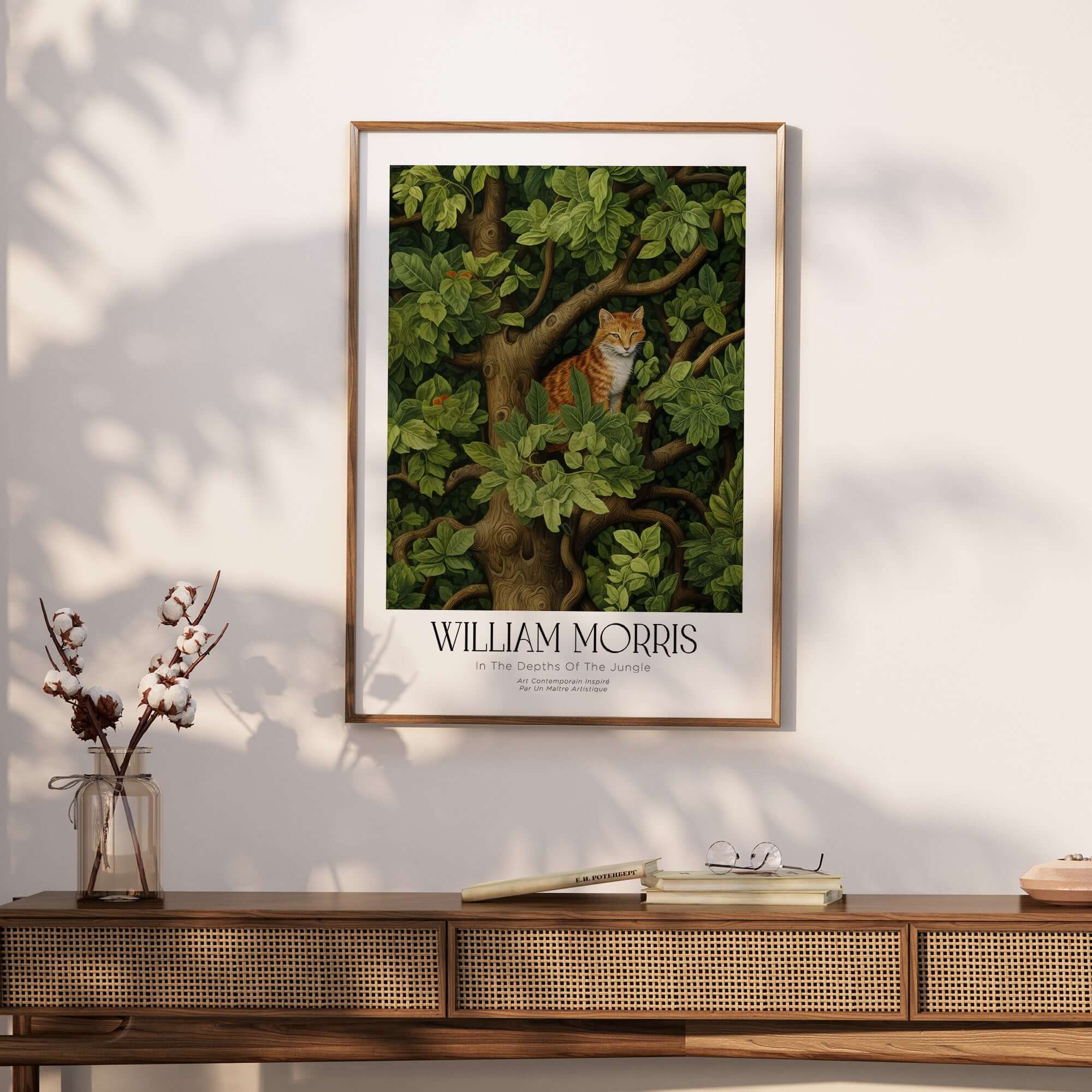 William Morris Ginger Cat in Tree Botanical Art Print - Foliage Poster displayed on a wall above a wooden table.