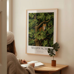 William Morris Ginger Cat in Tree Botanical Art Print - Foliage Poster displayed in a cozy interior.
