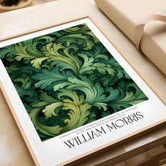William Morris Prints - Green Acanthus Swirl Pattern Art Print - Botanical Foliage Poster framed on a table.