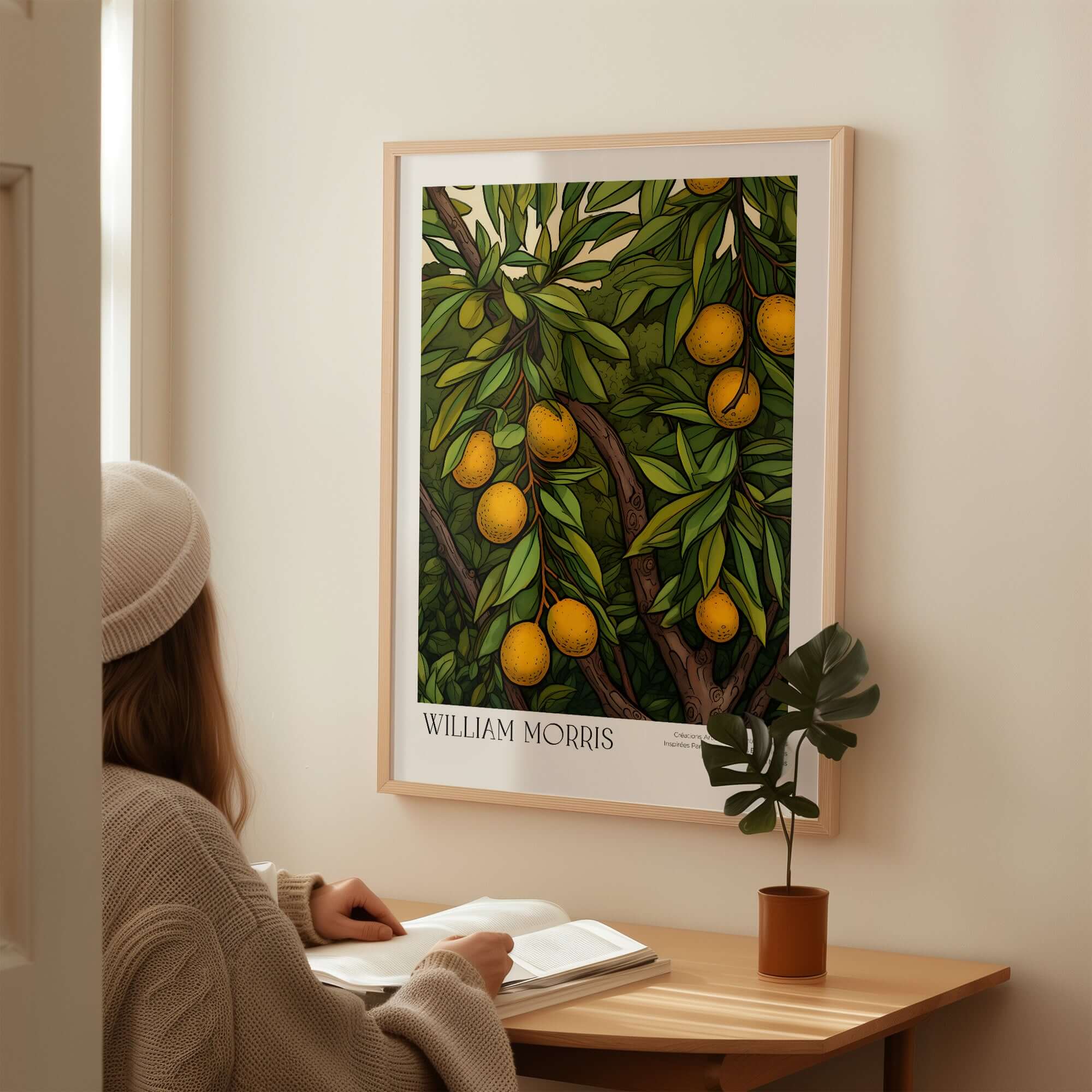 William Morris Prints - Illustrated Orange Tree Art Print - Botanical Fruit Poster displayed on a wall with a person reading.