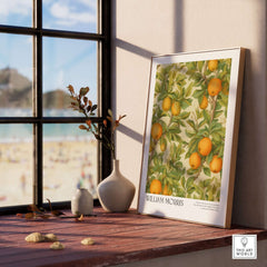 William Morris Prints - Orange Grove Fruit Tree Art Print - Botanical Poster framed by a window with beach view.