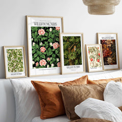 William Morris Prints - Pink Blossom Art Print - Dark Botanical Poster displayed on a wall with decorative pillows.