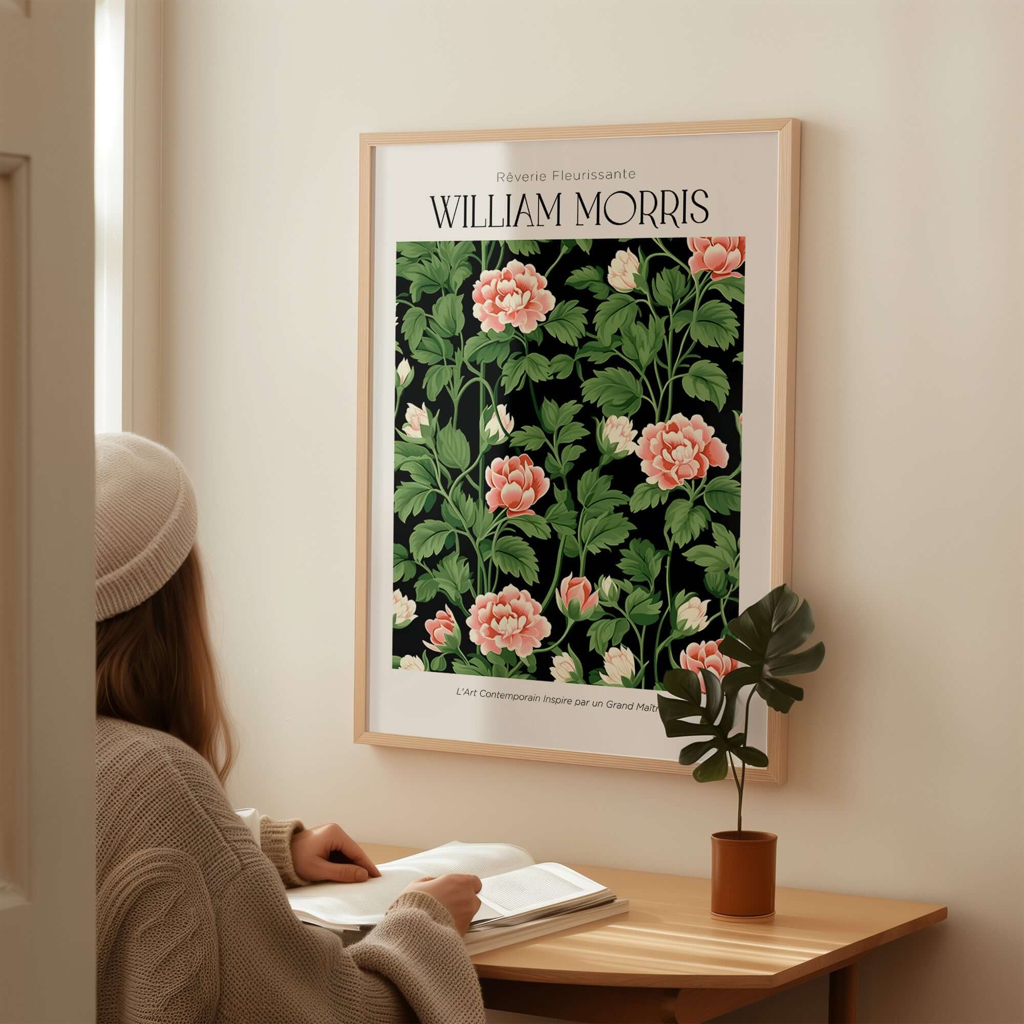 William Morris Prints - Pink Blossom Art Print - Dark Botanical Poster displayed on wall with person reading nearby.