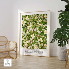 William Morris Prints - White Blossom Branch Art Print - Exhibition Poster displayed in a modern interior with plants.