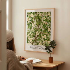 William Morris Prints - White Blossom Branch Art Print - Exhibition Poster displayed in a cozy interior setting.