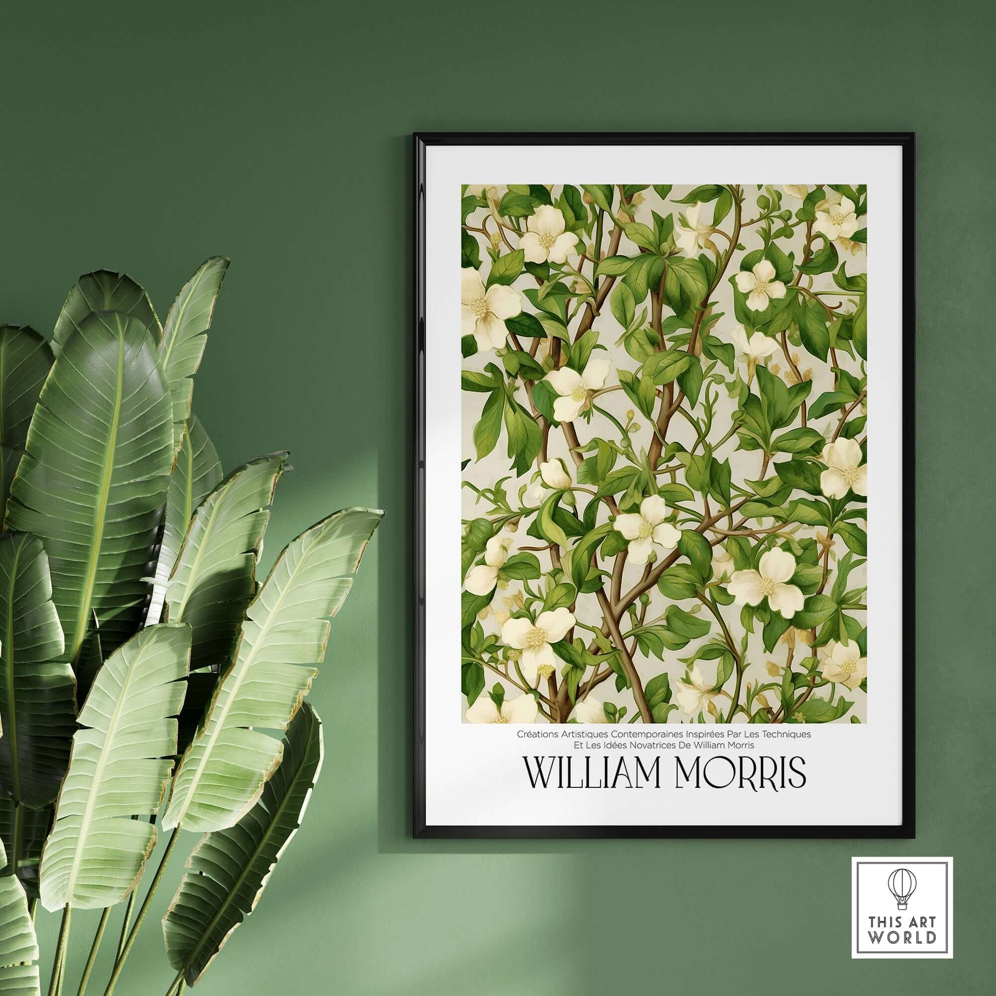 William Morris Prints - White Blossom Branch Art Print - Exhibition Poster displayed on a green wall with plants.