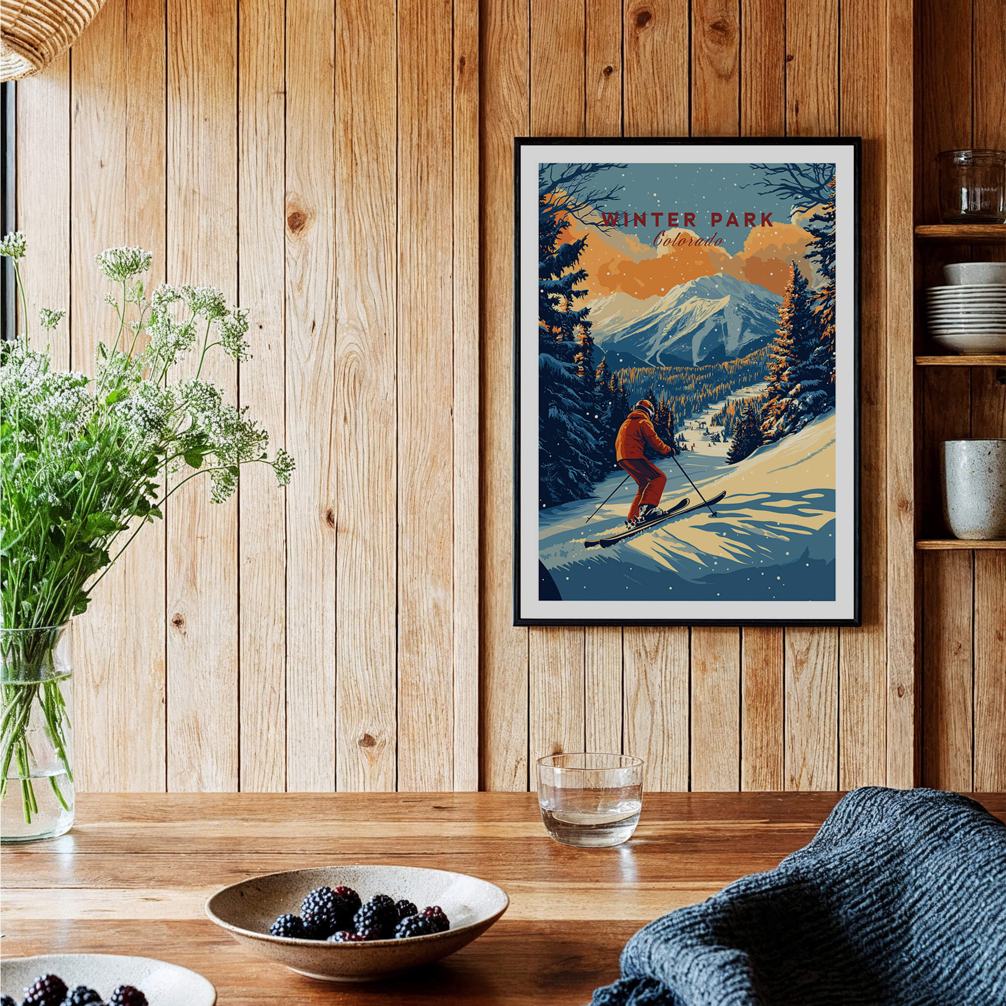 Winter Park Print Colorado ski poster framed on wooden wall with flowers and decor, showcasing adventure and beauty.