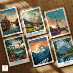 Set of six framed travel posters featuring Venice, Paris, The Highlands, Singapore, Wrangell-St. Elias National Park, and Sri Lanka on a wooden floor.