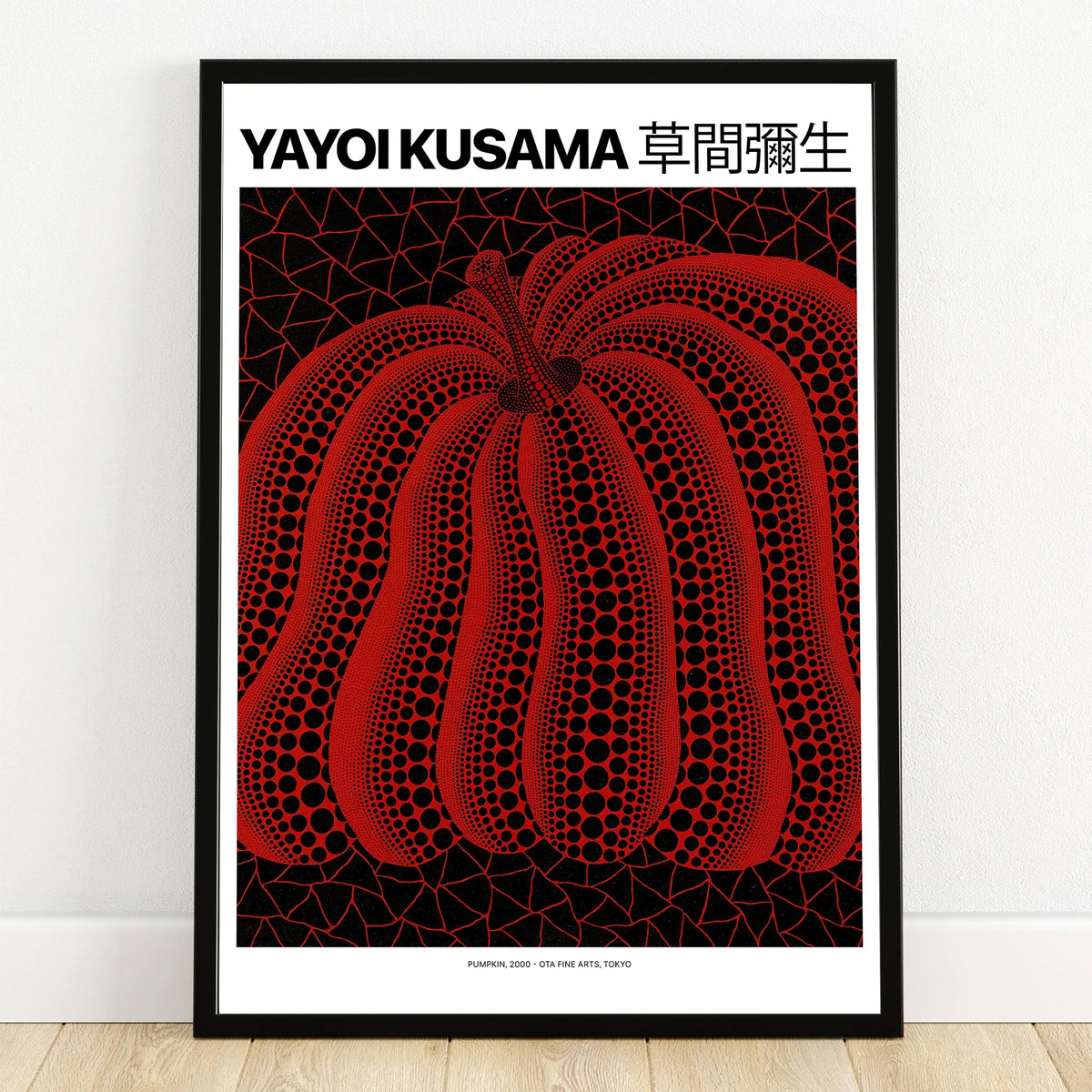 Framed wall art print of a red pumpkin with black dots on a geometric background
