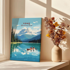 Yoho National Park art print with lake and mountains, displayed by window and dried flowers