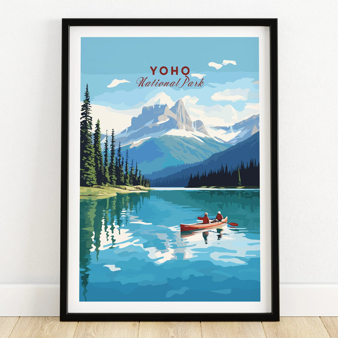Yoho National Park art print with colorful lake, mountains, canoe, in black frame on floor