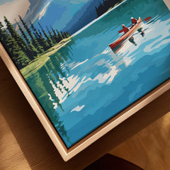 Framed canvas wall art of a lake scene with two people canoeing and pine trees by the water.