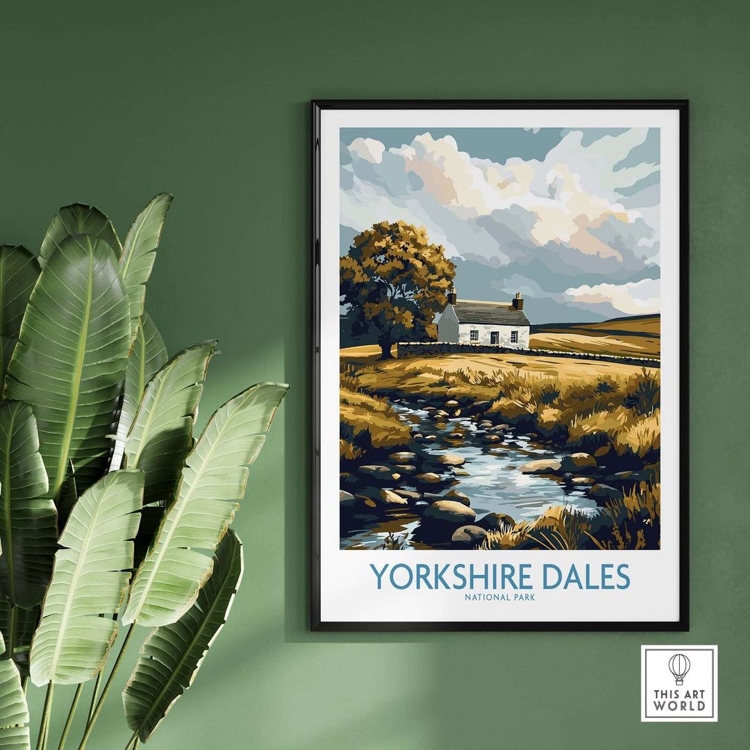 Yorkshire Dales National Park print featuring a stone cottage and serene stream, framed and displayed on green wall.