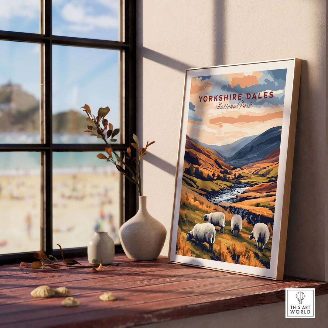 Yorkshire Dales National Park travel print featuring sheep and rolling hills displayed indoors by a window.