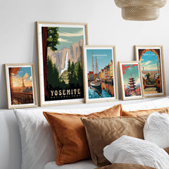 Yosemite National Park Print showcased among various framed travel prints in a cozy living room decor.