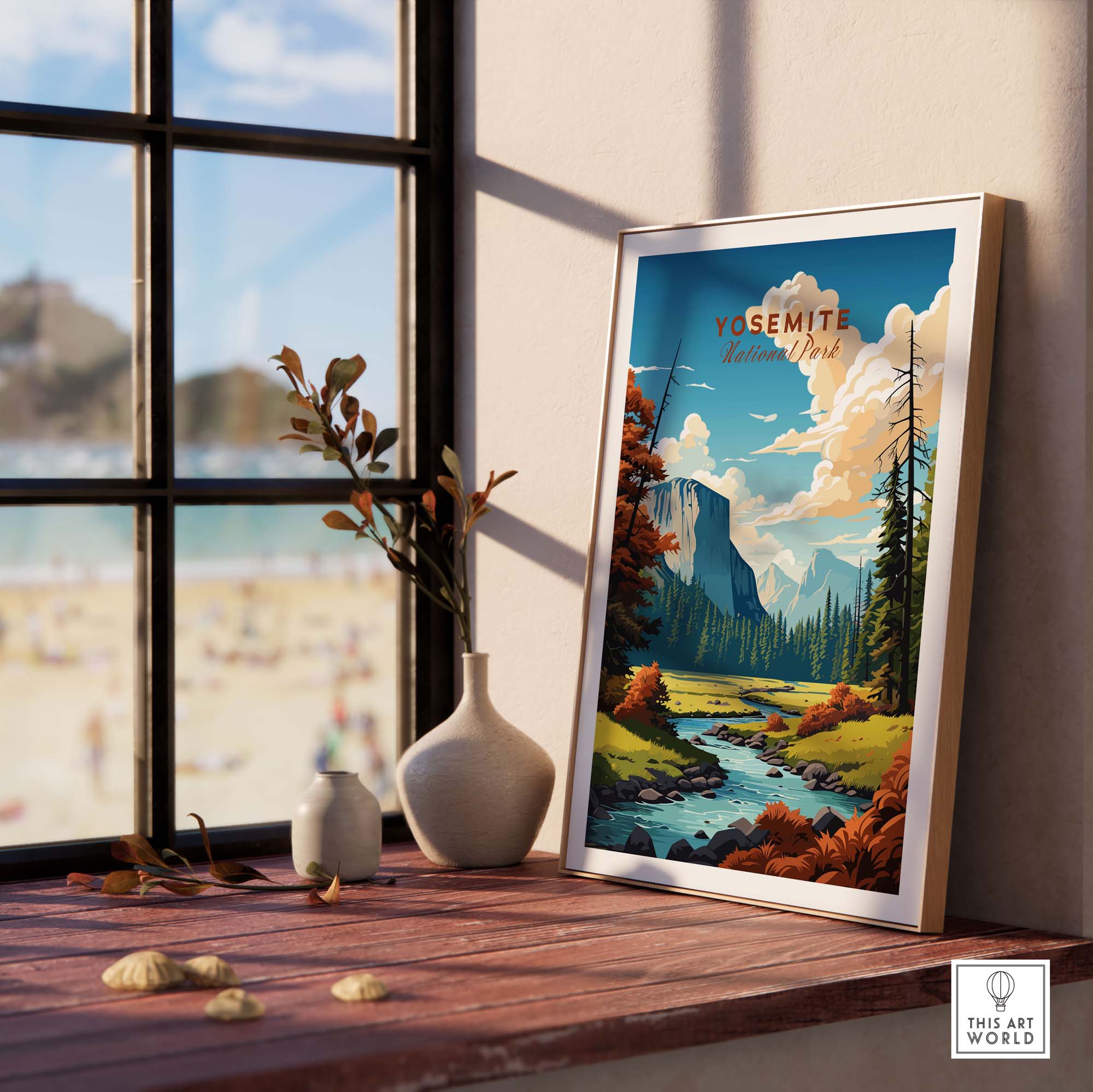 Framed Yosemite National Park poster on a wooden table by a window, showcasing stunning landscape art.