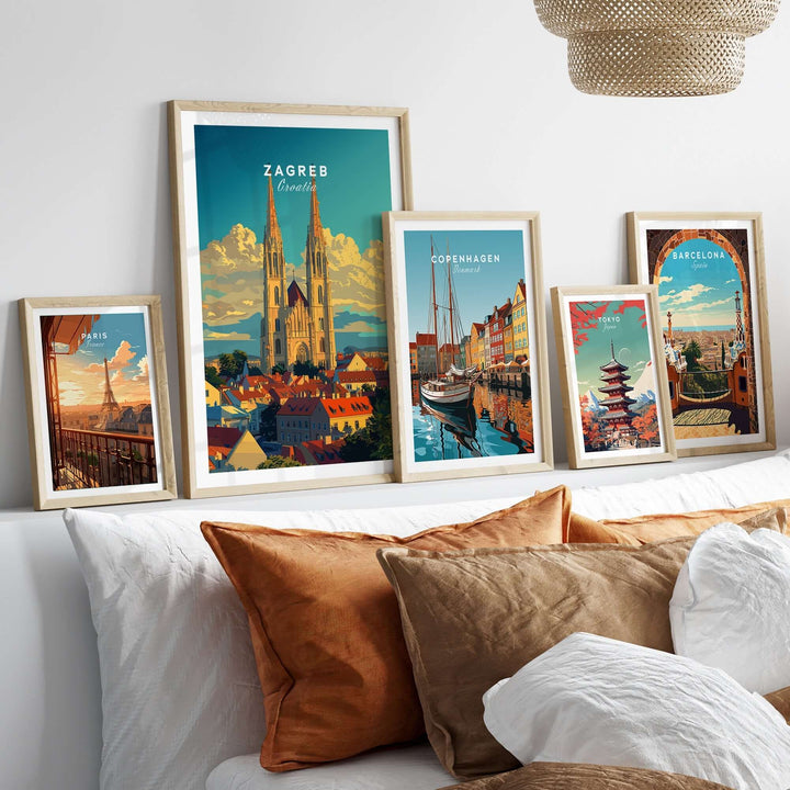 Decorative Zagreb Croatia poster displayed among framed city posters on a stylish bed with decorative pillows.