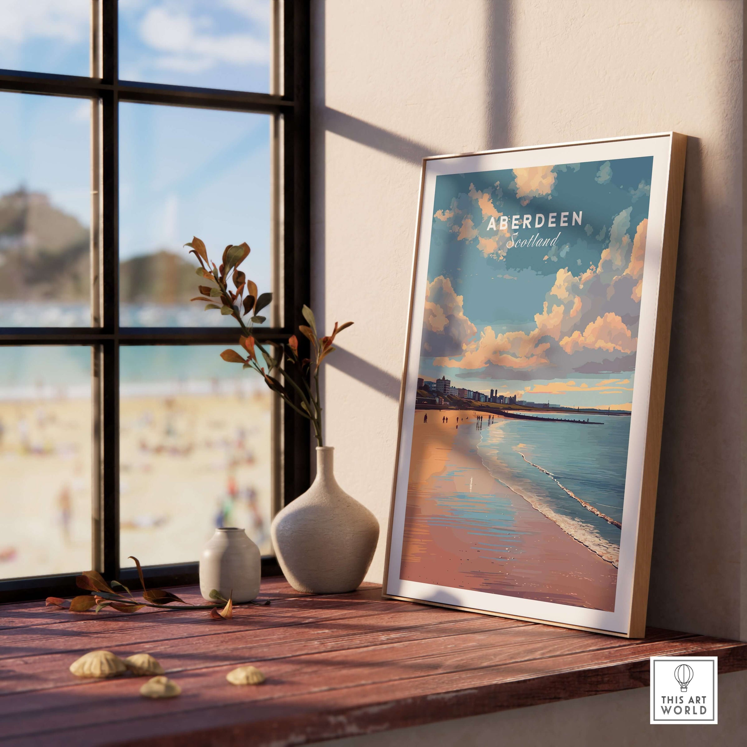 Aberdeen Beach Sunset Seascape Print | Colourful Coastal Wall Decor displayed on a wooden table by a window.