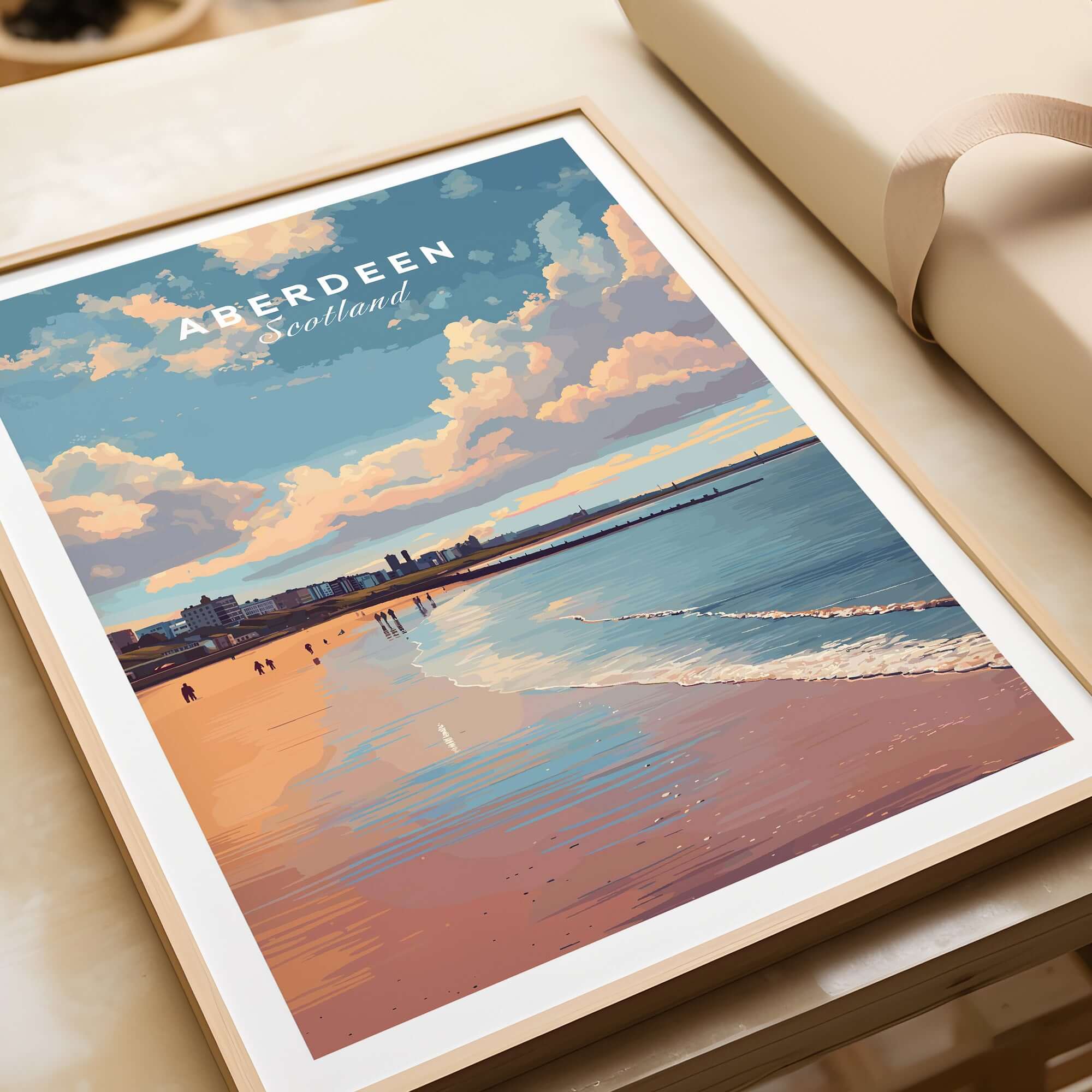 Aberdeen Beach Sunset Seascape Print | Colourful Coastal Wall Decor in a stylish frame on a table.