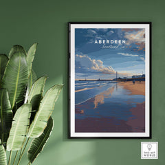 Aberdeen Dusk Beach Seascape Poster | Scottish Seaside Home Art displayed on a green wall with a plant nearby.