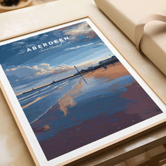 Aberdeen Dusk Beach Seascape Poster | Scottish Seaside Home Art framed on a table showcasing serene beach view.