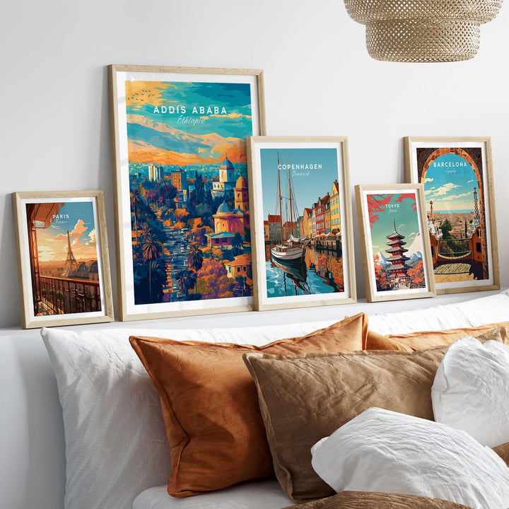 Addis Ababa sunset poster with cityscape art prints displayed above a cozy sofa.